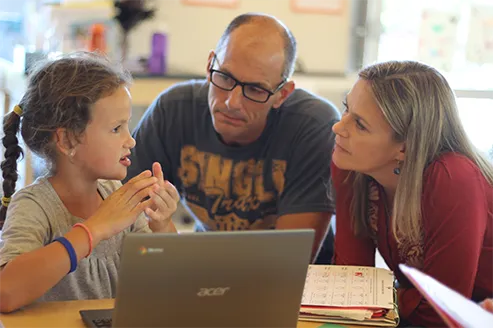 Parents and child learning together at Acton Academy College Station